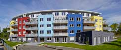 In die fünfstöckige, halbrunde Anlage der Vaubanaise eG im Freiburger Stadtteil Vauban zogen im Juni 2013 die ersten Bewohner ein: Dieses Projekt wird jetzt zum Vorbild für die Regensburger Genossenschaft "W.I.R." (Foto: Urs Bürkle)