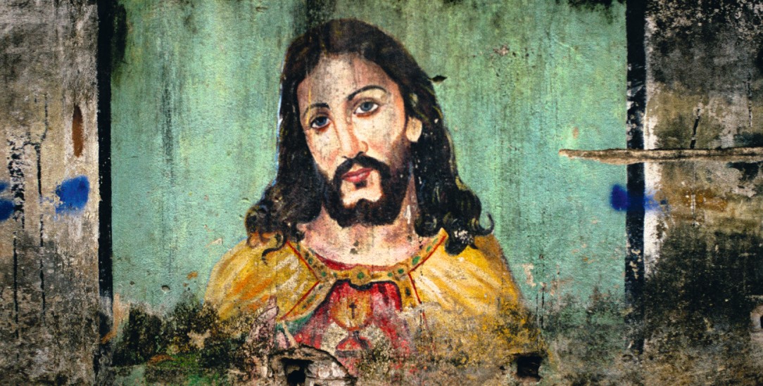 Wesenseins mit Gott? Jesus Christus als Wandgemälde in den Slums der indischen Stadt Chennai. (Foto: Alamy Stock Photo / India-Chennai / Shaun Higson)